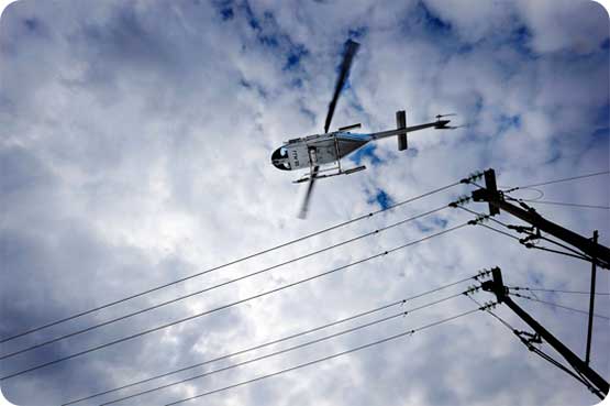 Helicopter doing powerline inspections